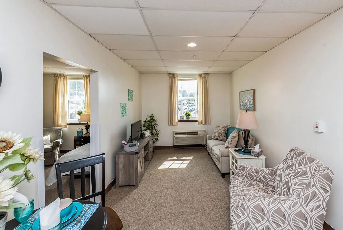 A cozy apartment living room with contemporary decor and ample natural light.