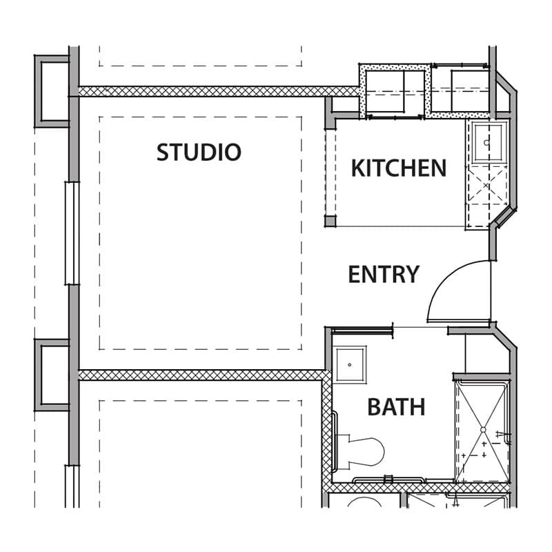 A floor plan of a studio apartment featuring a kitchen, bathroom, and main living area.