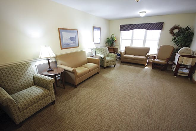A cozy living room with comfortable seating and soft lighting.