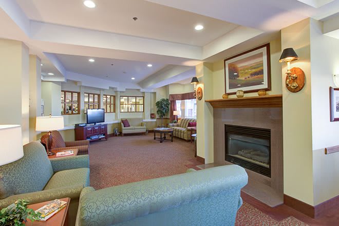 Cozy living room with a fireplace and comfortable seating.