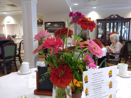 A vibrant floral centerpiece brightens up the dining area.