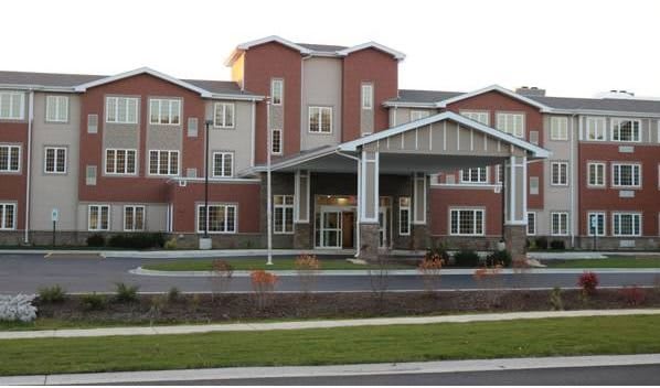 A modern residential apartment building with a brick exterior.