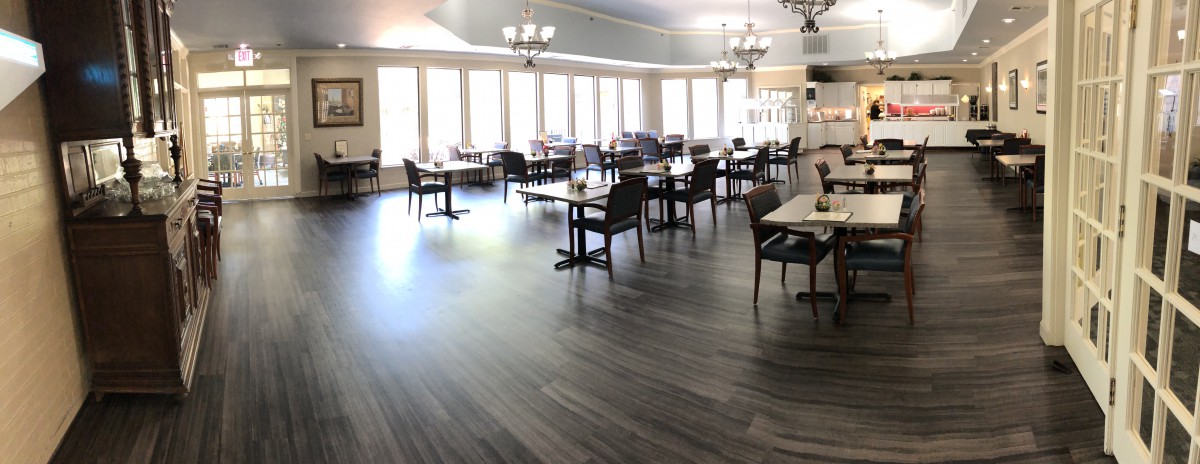 A spacious dining area with modern decor and ample natural light.