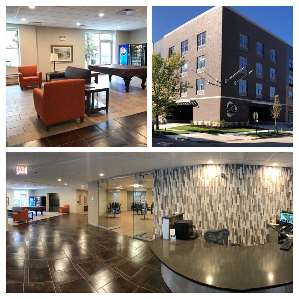 A modern building with well-furnished interiors, featuring a reception area and a lobby.