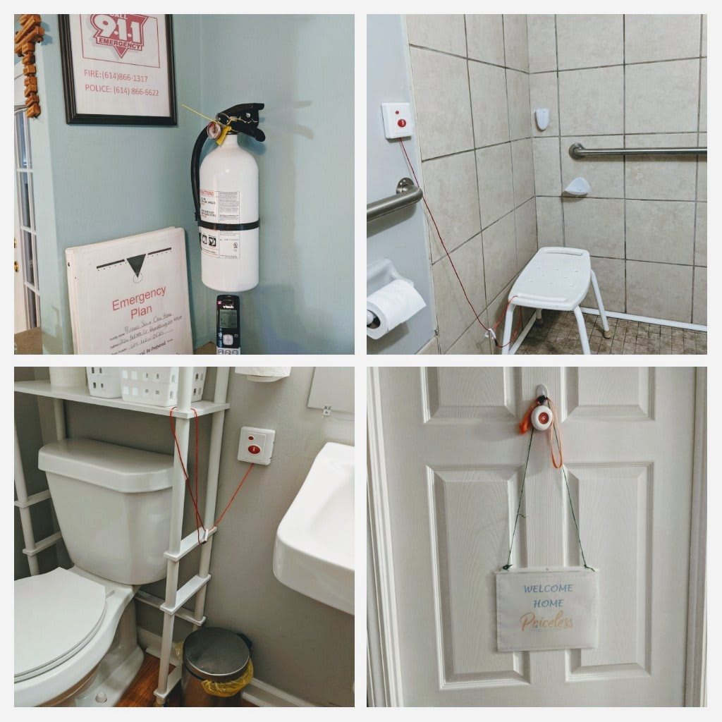 An accessible bathroom equipped with safety features such as a shower chair, handrails, and a fire extinguisher.