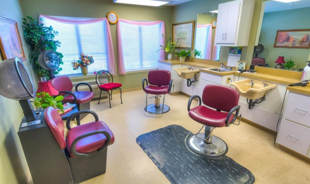 A brightly lit beauty salon with styling chairs and mirrors, ready for clients.