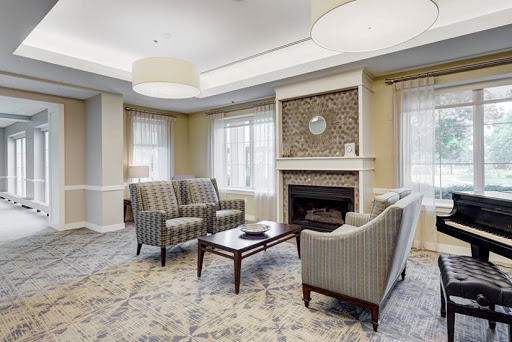 A cozy living room featuring comfortable seating, a fireplace, and stylish decor.