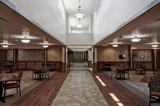 A spacious and well-lit lobby featuring modern design elements and comfortable seating.