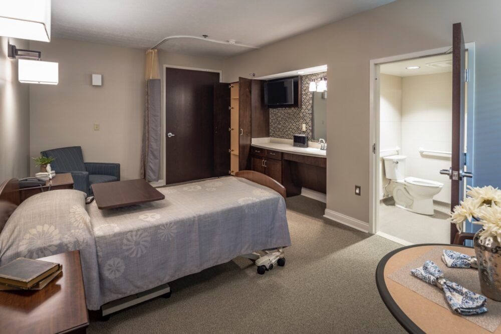 A modern and clean hospital room equipped with medical facilities.