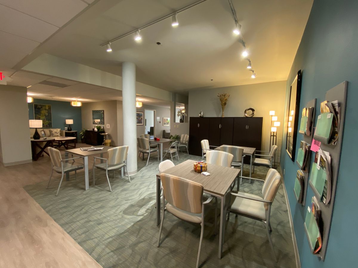 A cozy indoor dining area with neatly arranged tables and chairs.