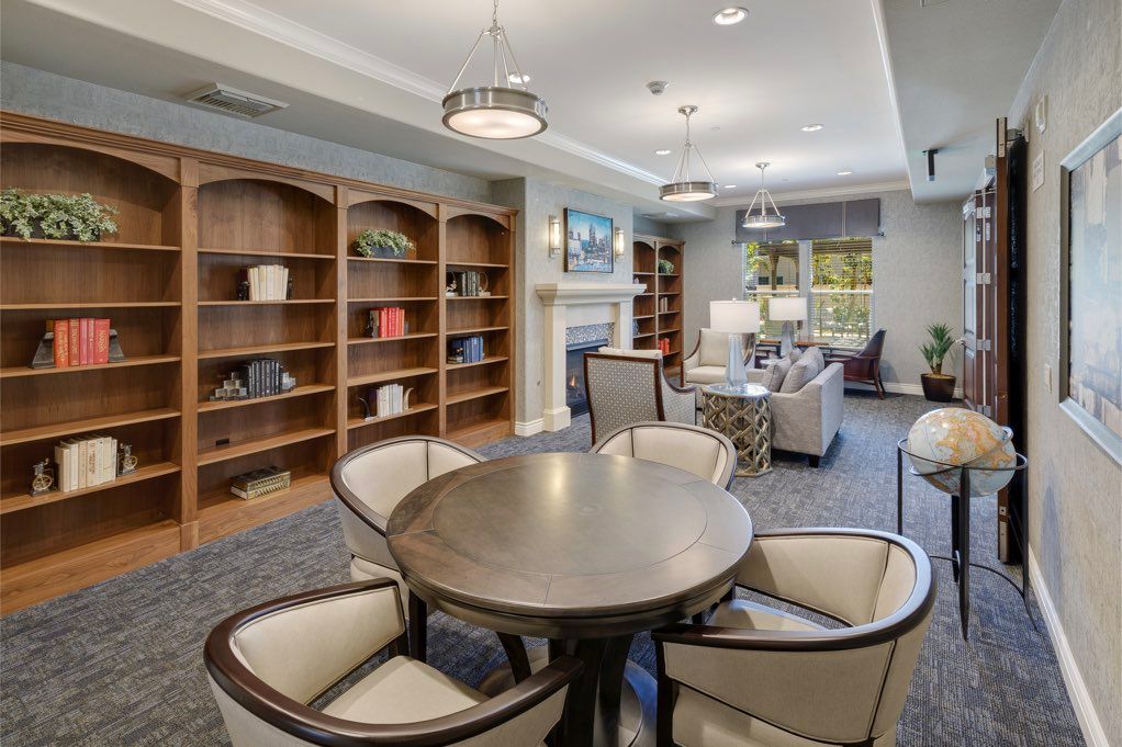 A modern library interior with comfortable seating and bookshelves.