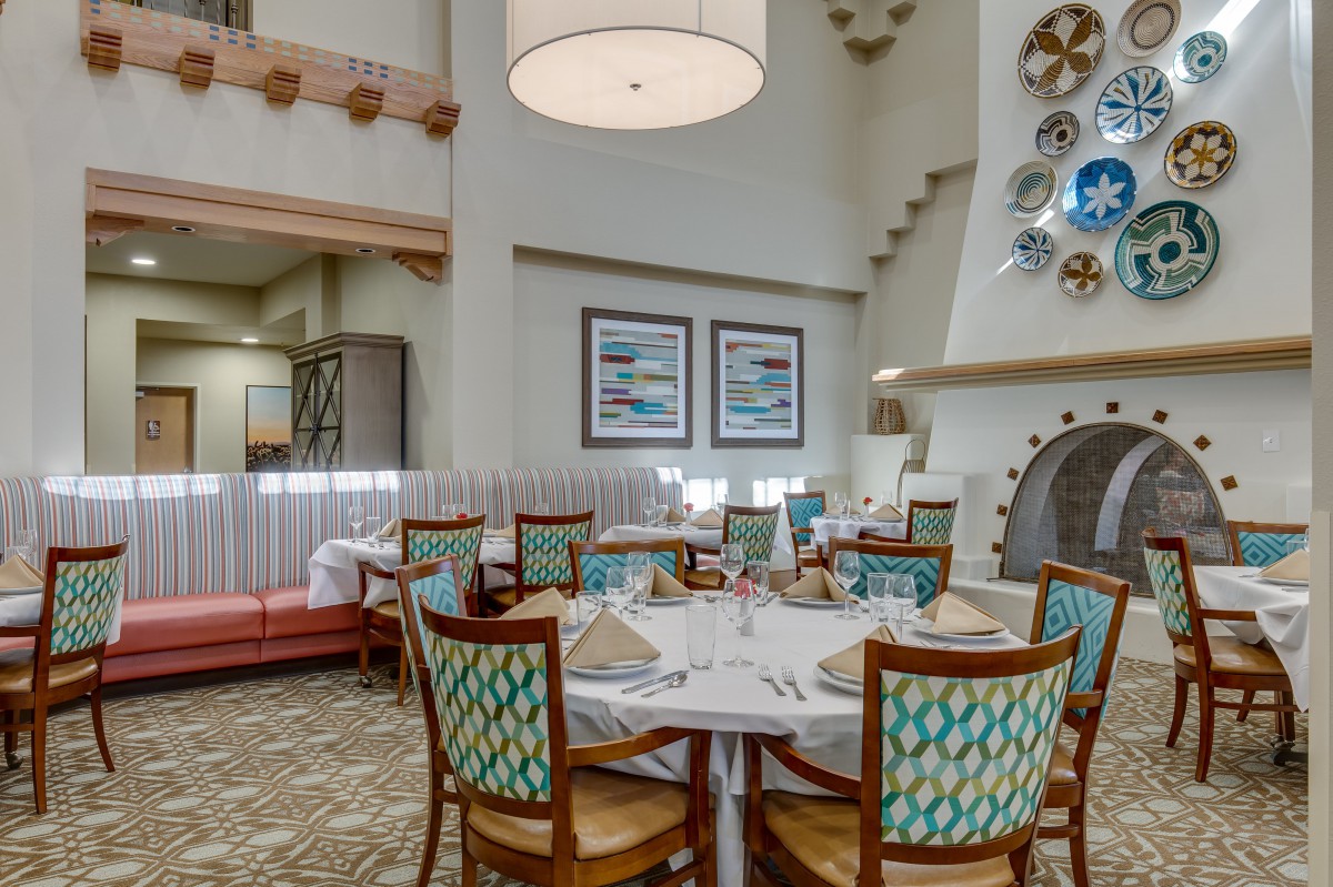 A beautifully set dining area in an elegant restaurant interior.