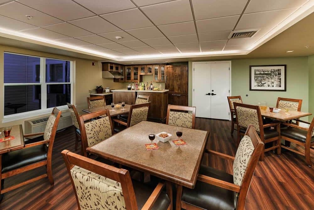 A cozy dining area with wooden furniture and warm lighting.