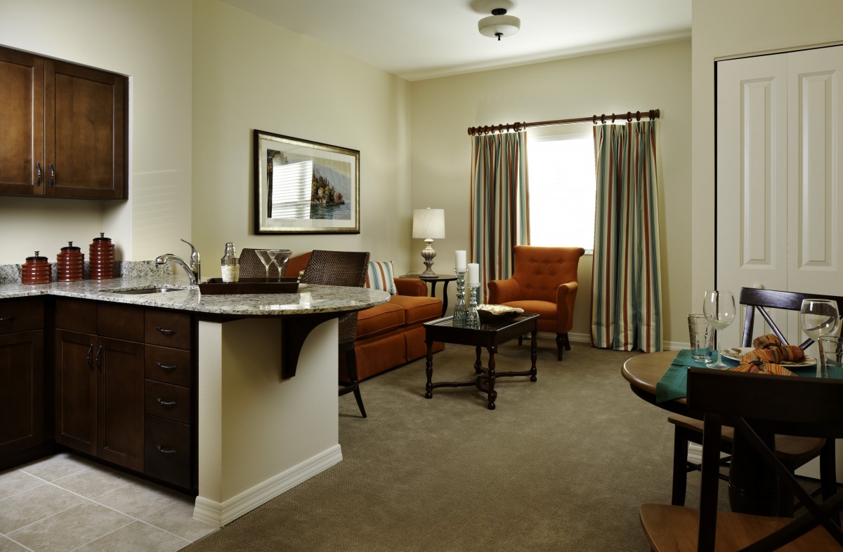 A cozy living room with comfortable seating and elegant decor.