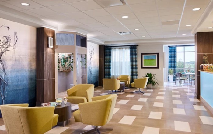 A modern lobby with stylish seating and decorative artwork.