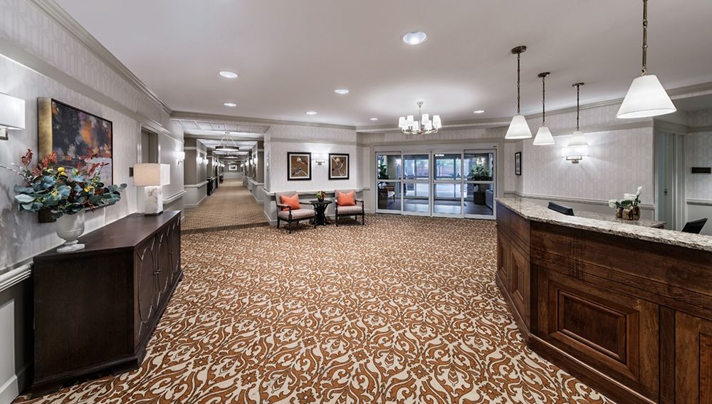 Spacious hotel lobby with elegant decor and comfortable seating.