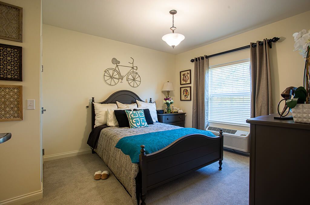 Cozy bedroom with modern decor and bicycle wall art.