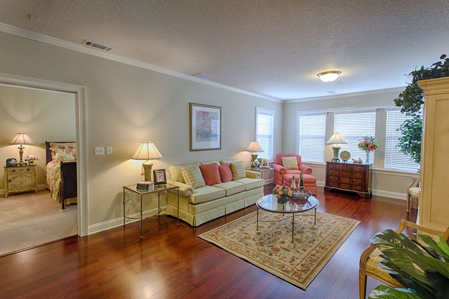 A cozy living room with elegant furnishings and warm lighting.