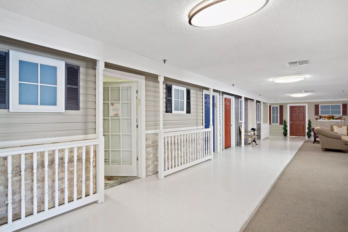 A clean and well-lit corridor with multiple doors.