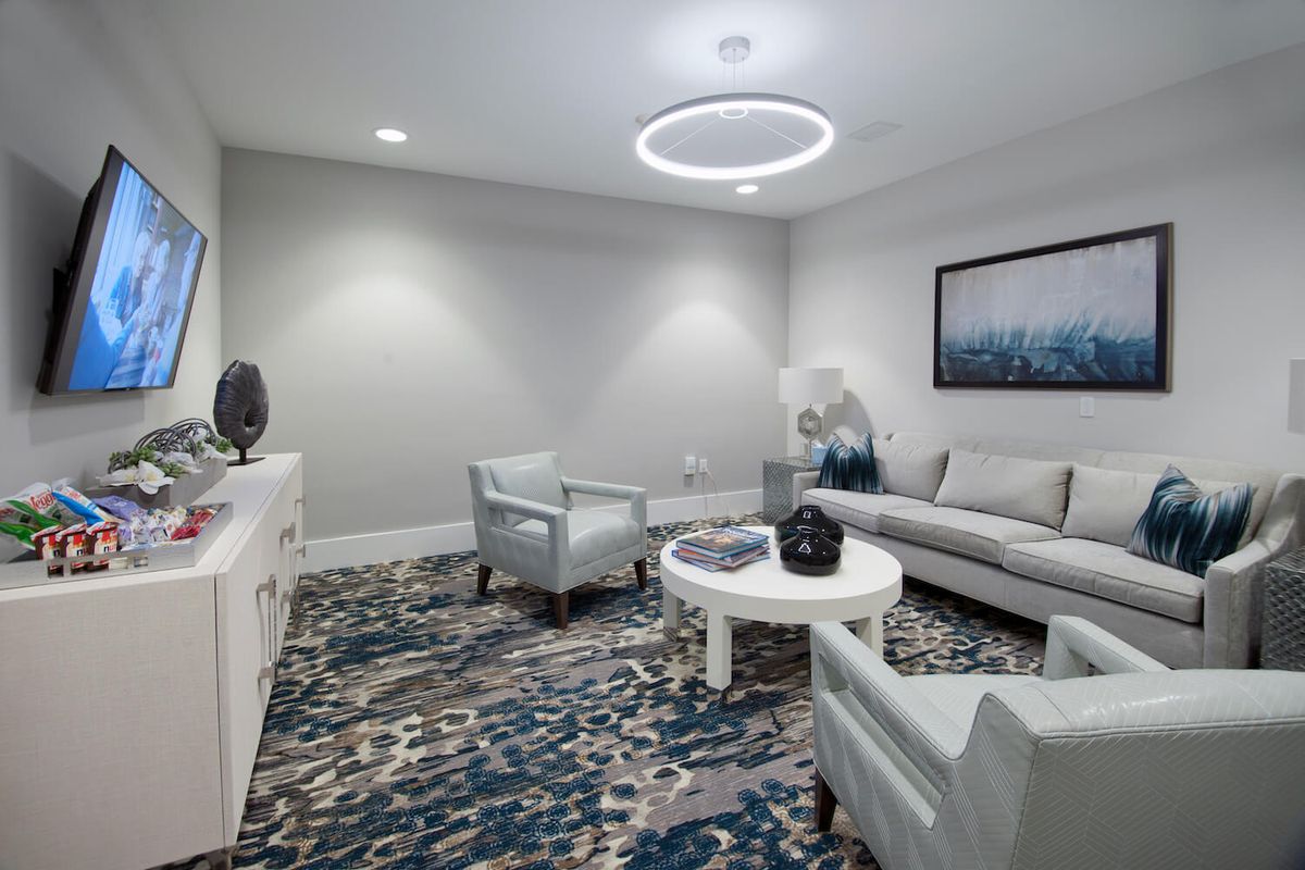 A modern living room with stylish furniture and decorative elements.