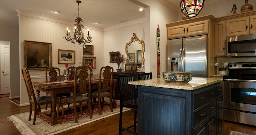 A beautifully decorated dining room featuring elegant furniture and warm lighting.