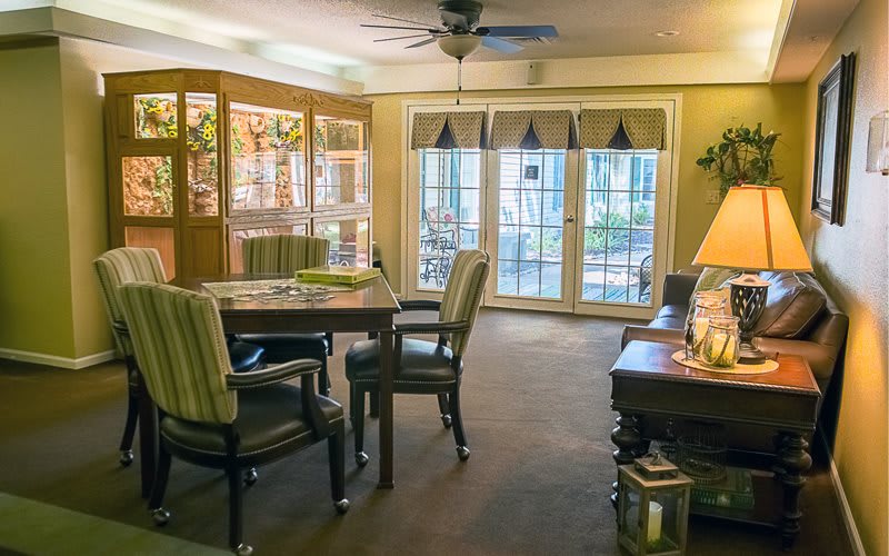 A cozy living and dining area with comfortable seating and large windows.