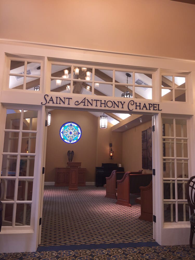 Entrance to Saint Anthony Chapel with stained glass window and interior view.