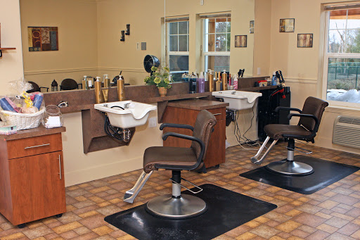 A cozy salon setup featuring styling chairs and wash stations, ready for hair services.