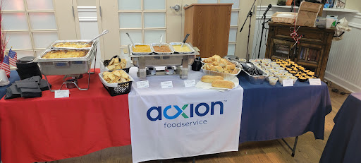 A catering setup featuring a variety of dishes on display.