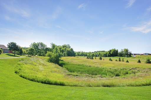 A serene landscape showcasing lush greenery under a clear blue sky.