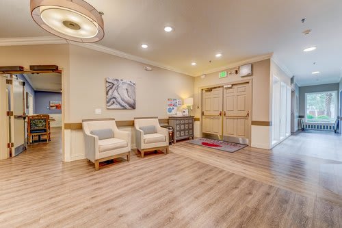 A cozy lobby area with comfortable seating and warm lighting.