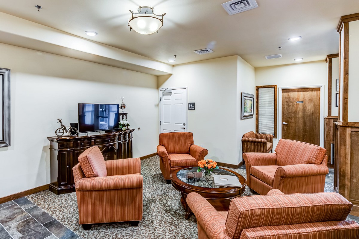 A cozy living room with comfortable seating and a television.
