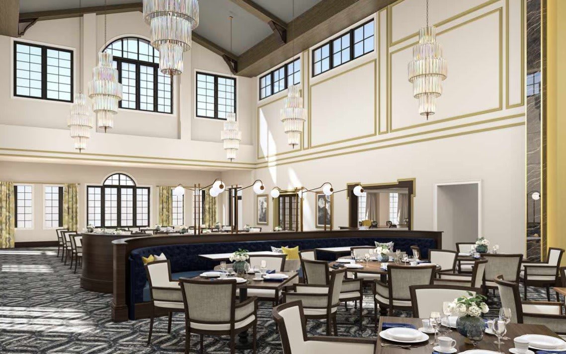 An elegant restaurant interior with tasteful chandeliers and neatly arranged dining tables.