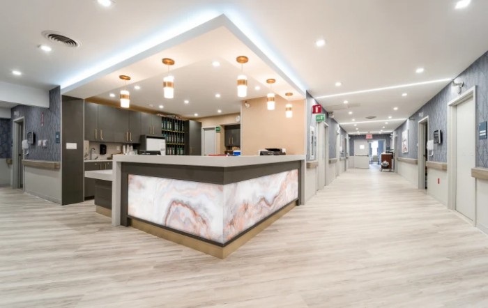 A modern reception area with stylish lighting and a marble counter.