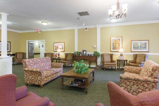 A cozy living room with comfortable seating and elegant decor.