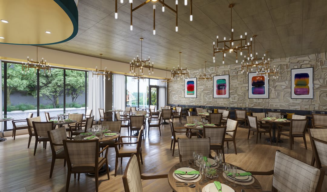 A modern restaurant dining area with elegant chandeliers, contemporary artwork, and neatly arranged tables and chairs.