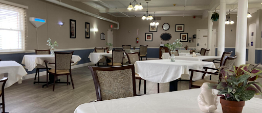 A spacious and elegantly set dining area, ready for guests.