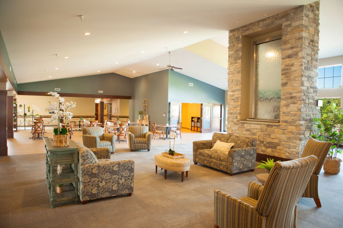 A spacious and modern lounge with comfortable seating and a cozy atmosphere.