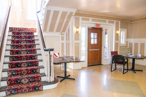 A beautifully designed lobby featuring an elegant staircase and inviting seating arrangements.