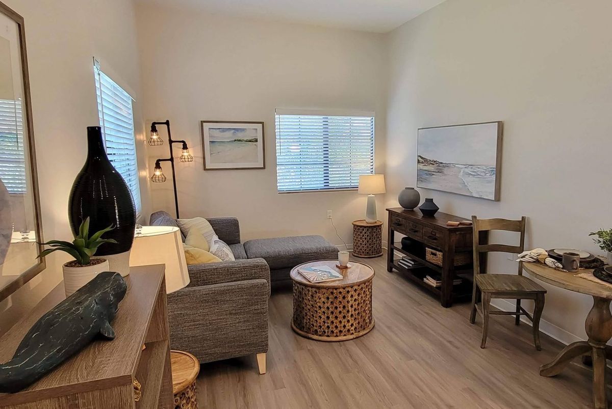 A cozy living room featuring modern furniture and decor with soft lighting.
