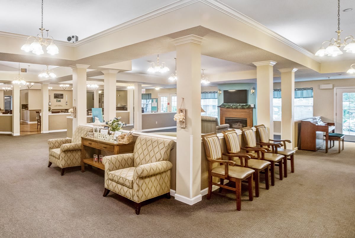 A spacious waiting area with comfortable seating and elegant decor.