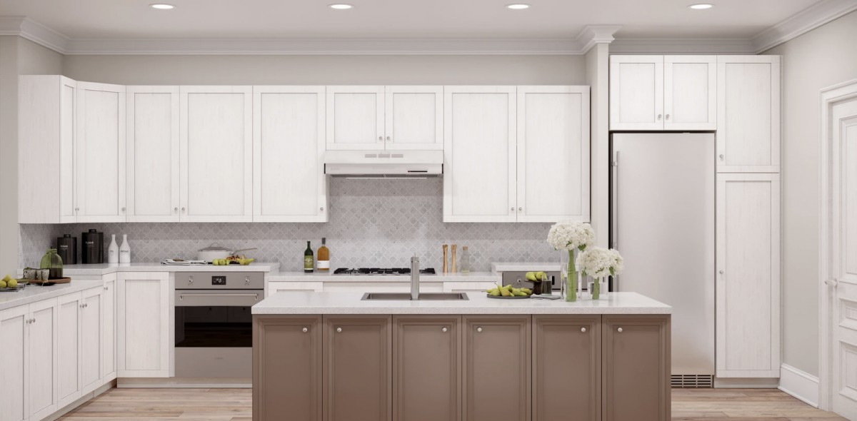 A modern kitchen with white cabinets, stainless steel appliances, and a central island featuring flowers as decoration.