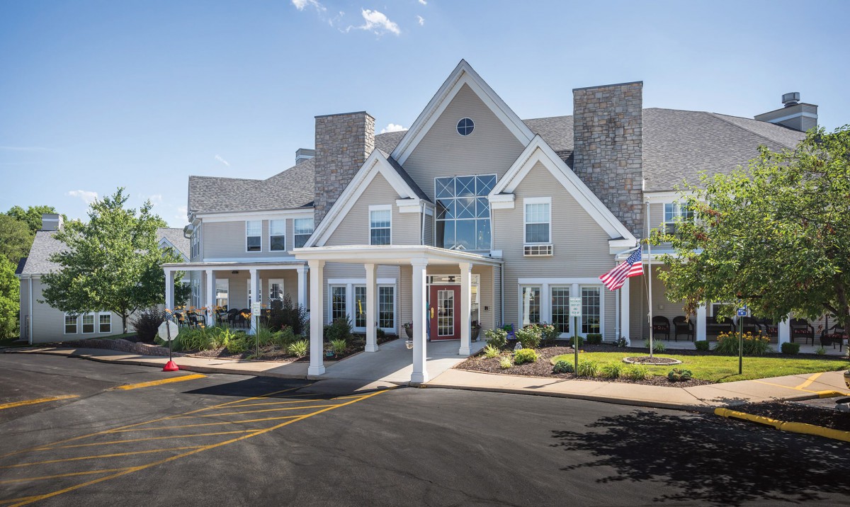 A large residential-style building with a welcoming entrance and manicured landscaping.