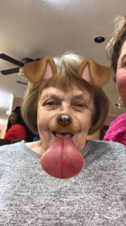 A playful selfie with a dog filter applied.