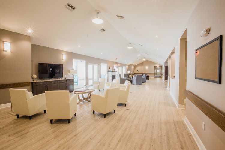 A spacious and well-lit lounge area with comfortable seating and modern decor.