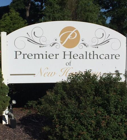 A sign for Premier Healthcare indicating a healthcare facility.