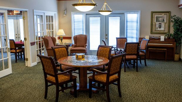 A cozy dining area with wooden furniture and warm lighting.