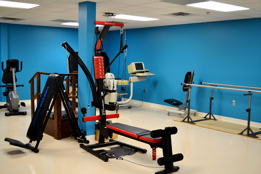 A well-equipped gym area featuring various fitness machines and exercise equipment.