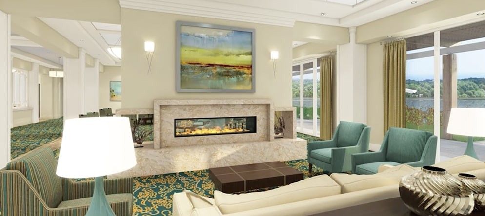 A modern living room with a stylish fireplace and artwork, featuring comfortable seating and elegant decor.
