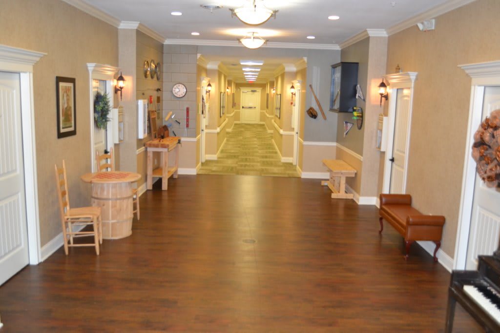 A spacious, well-lit hallway in a care facility or residential building.